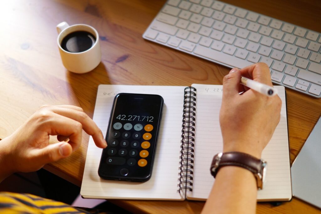 Man calculating app pricing